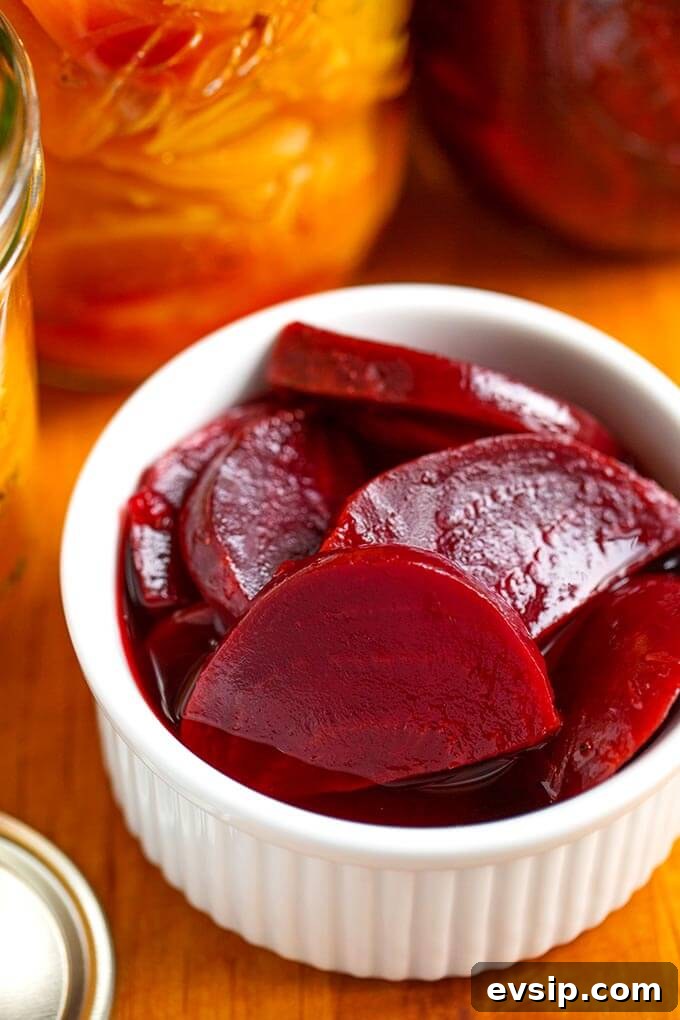 Quick Tangy Pickled Beets Recipe for Homemade Jars 3 Close up of pickled beets in small glass bowl on wooden board