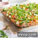 Salmon sushi bake on a baking paper lined tray.