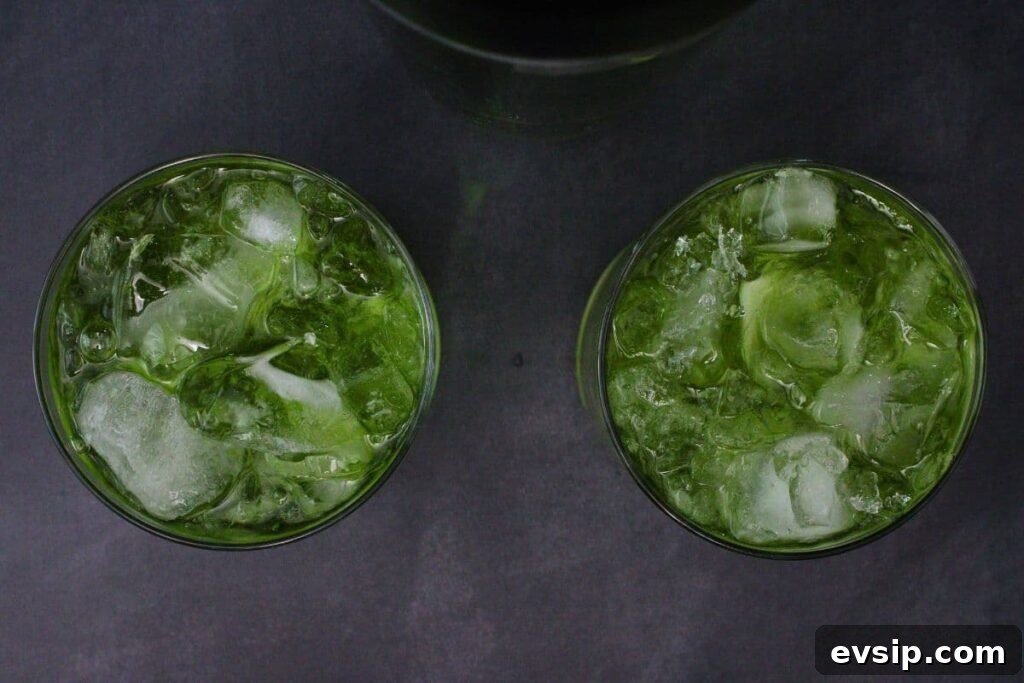 shake and strain flying dutchman cocktail into rocks glasses