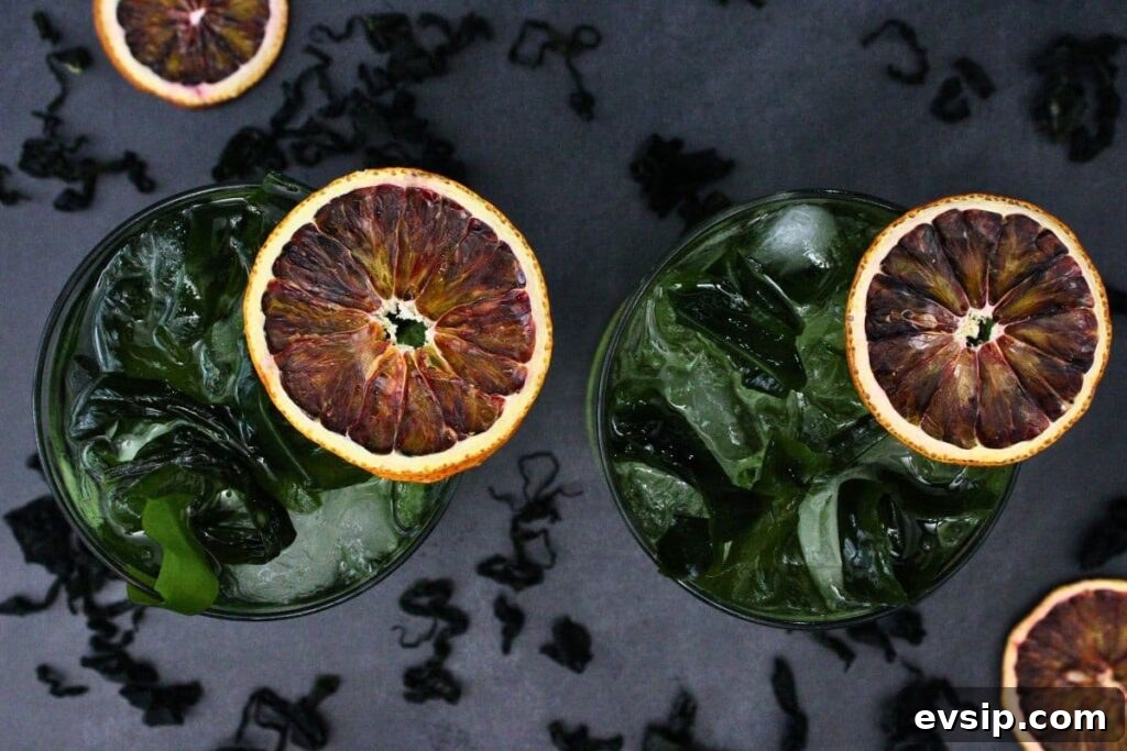 overhead view of two flying dutchman drinks with dried blood orange slices