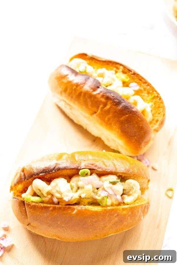 Scoop the shrimp salad onto toasted buns and finish with dill for a quick, flavorful sandwich.