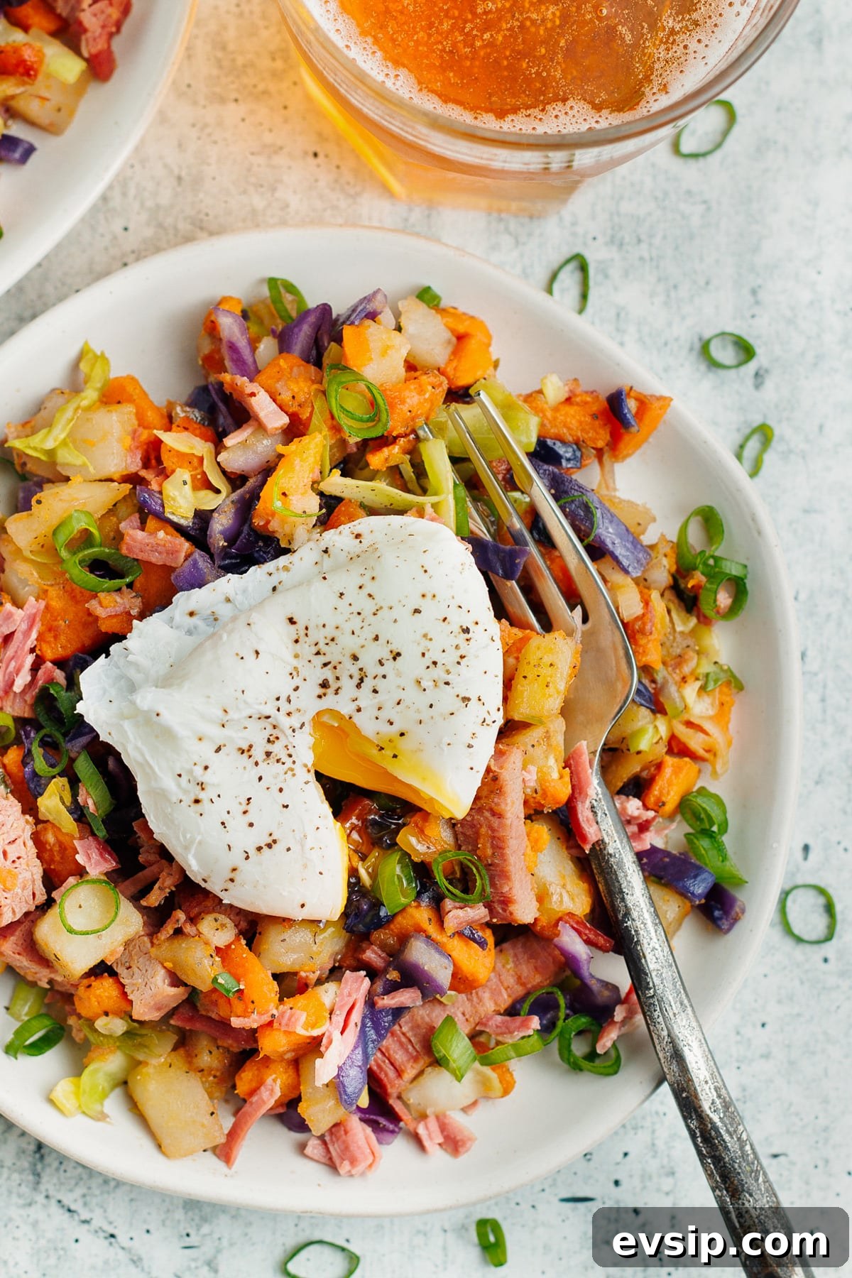 Corned Beef Hash and Poached Eggs Breakfast Recipe 2 This is a picture of the corned beef hash topped with a poached egg.