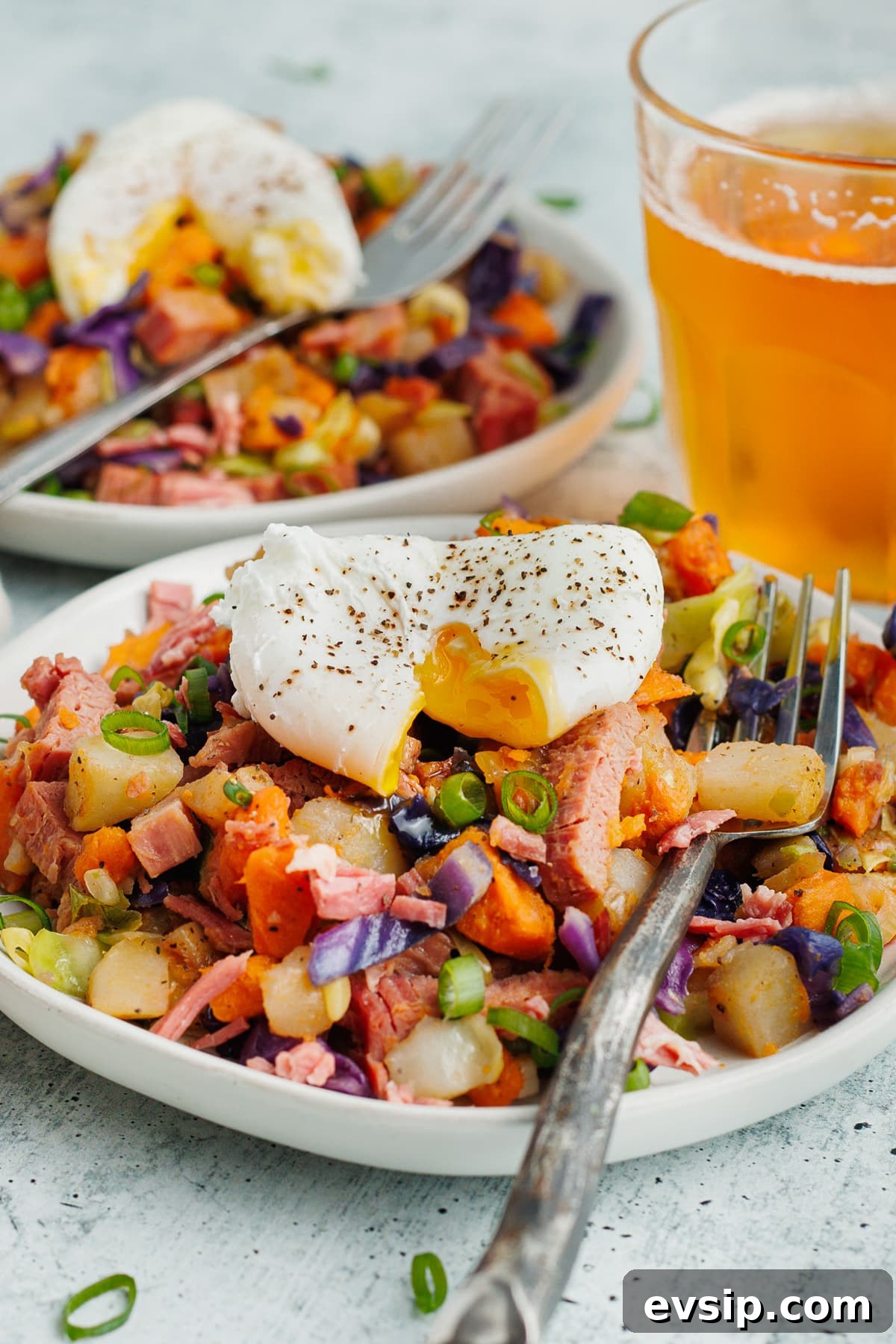 Corned Beef Hash and Poached Eggs Breakfast Recipe 12 This is a picture of the corned beef hash topped with a poached egg.
