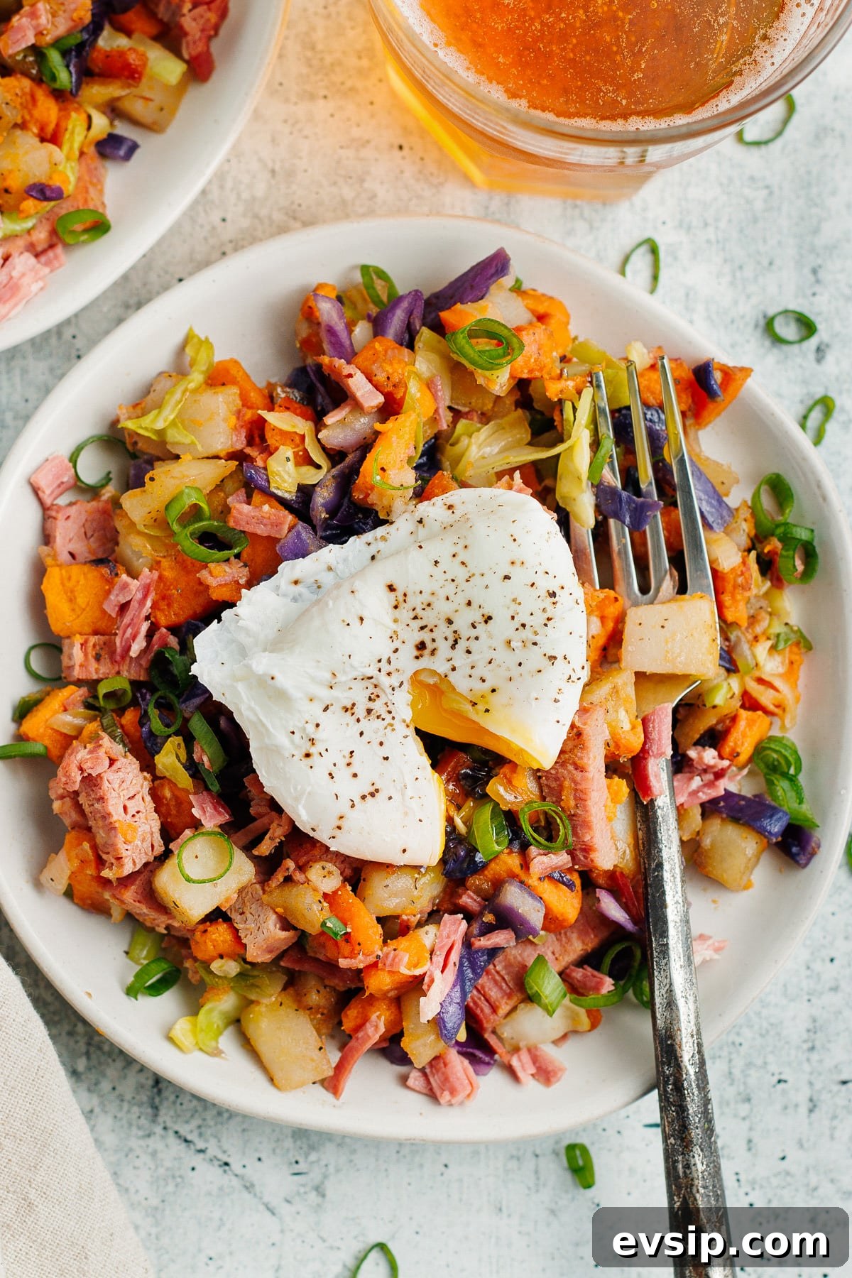 Corned Beef Hash and Poached Eggs Breakfast Recipe 13 This is a picture of the corned beef hash topped with a poached egg.