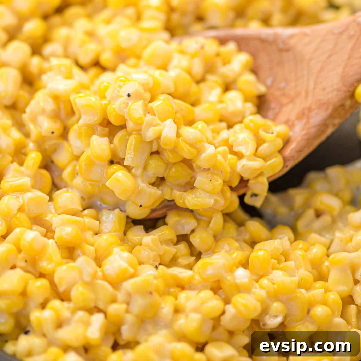 Skillet Corn with Honey Butter Glaze 2 honey butter skillet corn on a wooden spoon