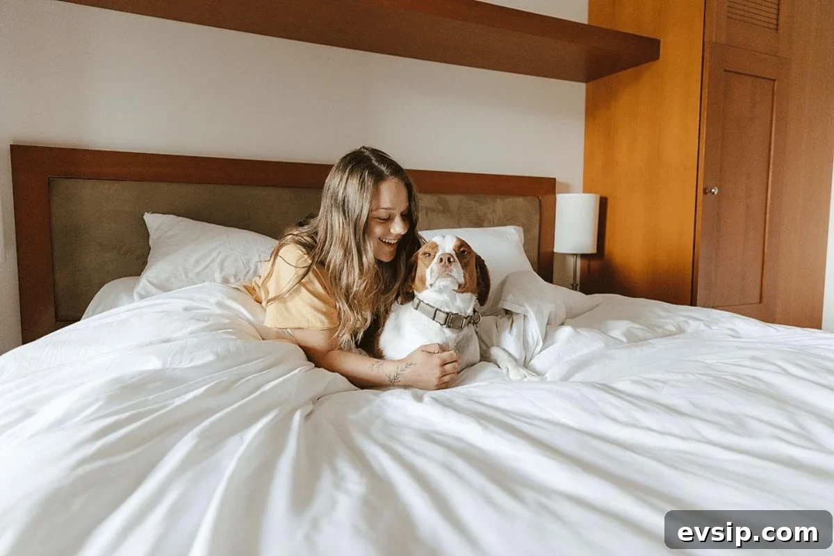 Whistler Weekend Itinerary: 2-Day Getaway from Vancouver 5 Girl and dog in hotel bed.