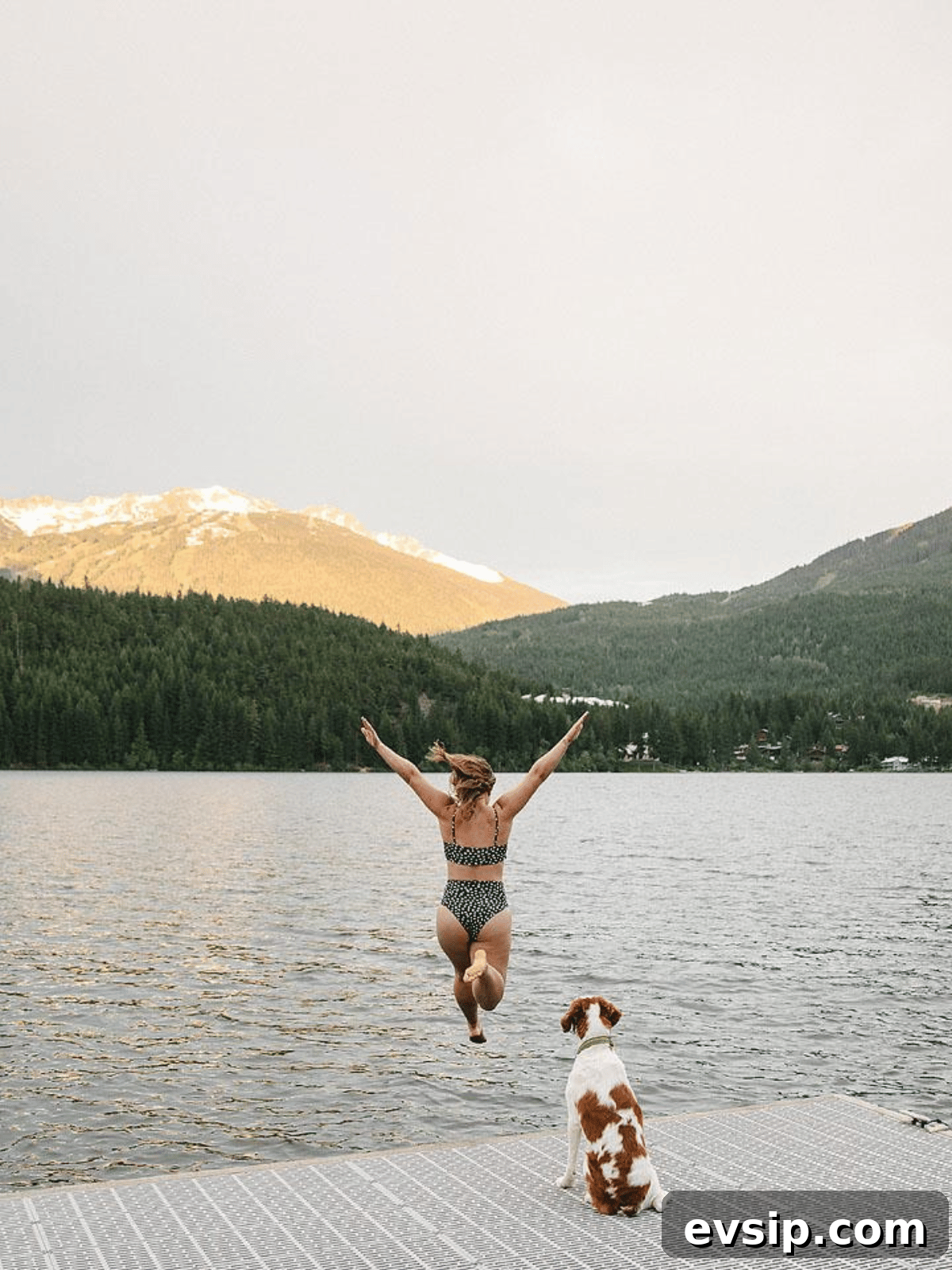 Whistler Weekend Itinerary: 2-Day Getaway from Vancouver 8 Girl and dog jumping into Alta Lake.