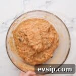 Carrot Cake Cupcakes from Box Mix — Moist, Spiced & Quick 6 carrot cake cupcake batter in a glass bowl.