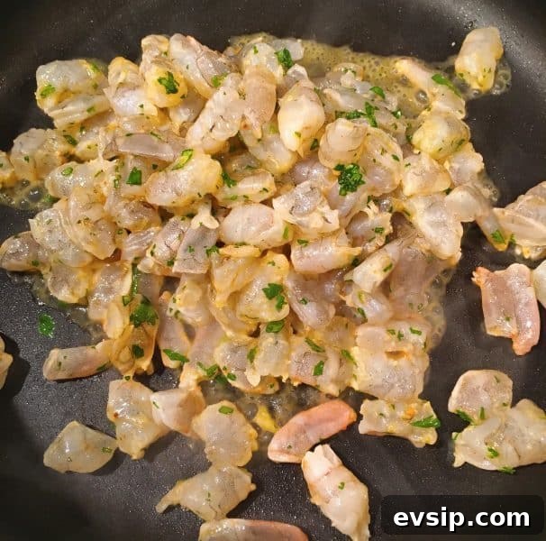 Cut up fresh shrimp for Shrimp Taco Salad