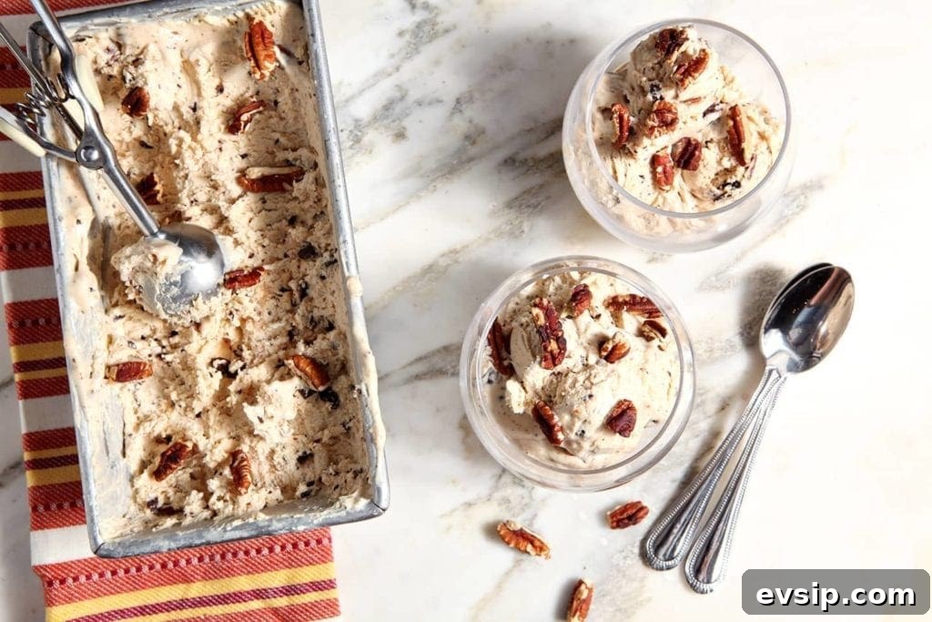 Two scoops of No Churn Peanut Butter Ice Cream in cups next to the pan of ice cream