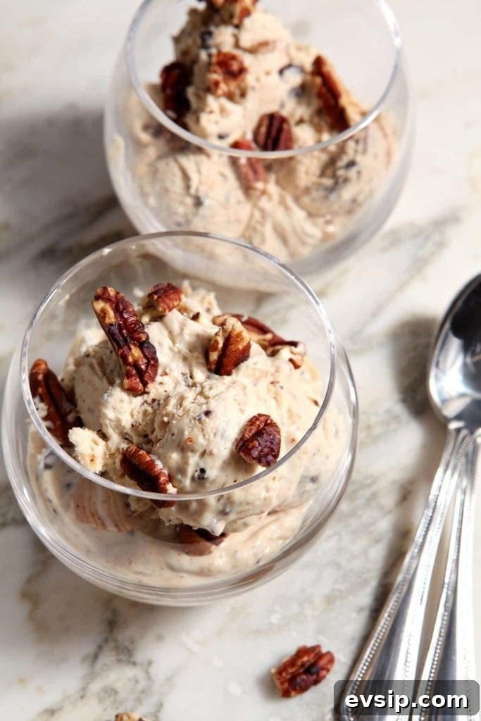 Scoops of no churn peanut butter ice cream in clear glass serving bowls