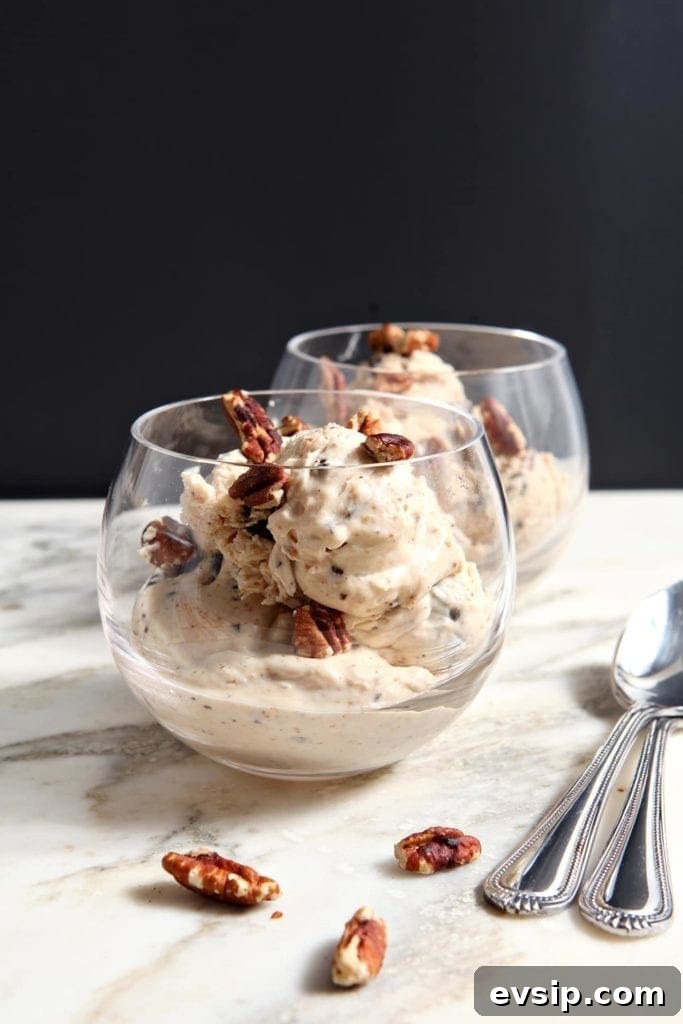 Two clear glass bowls hold no churn peanut butter ice cream with pecans