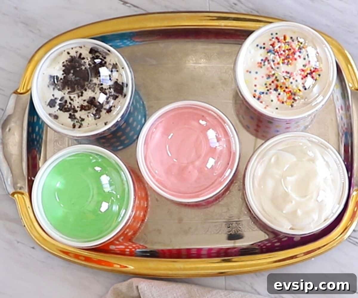 Ice cream in cups covered with plastic lids.