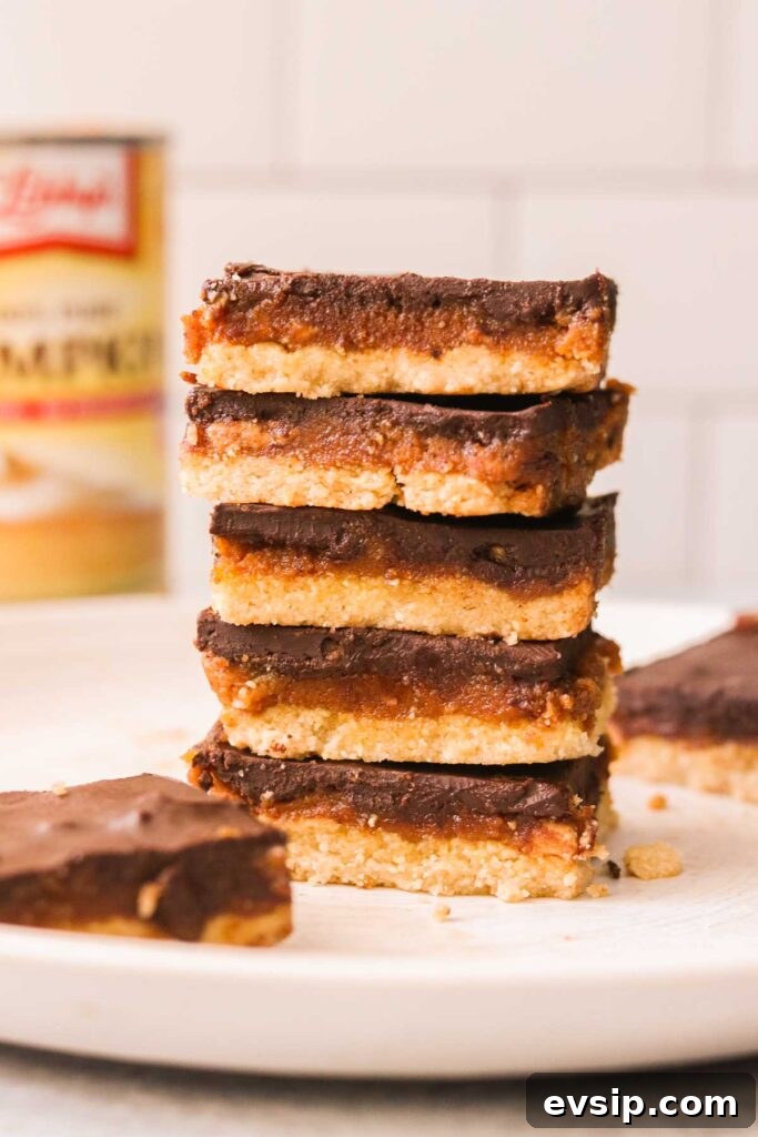 peanut butter pumpkin bars stacked on top of each other