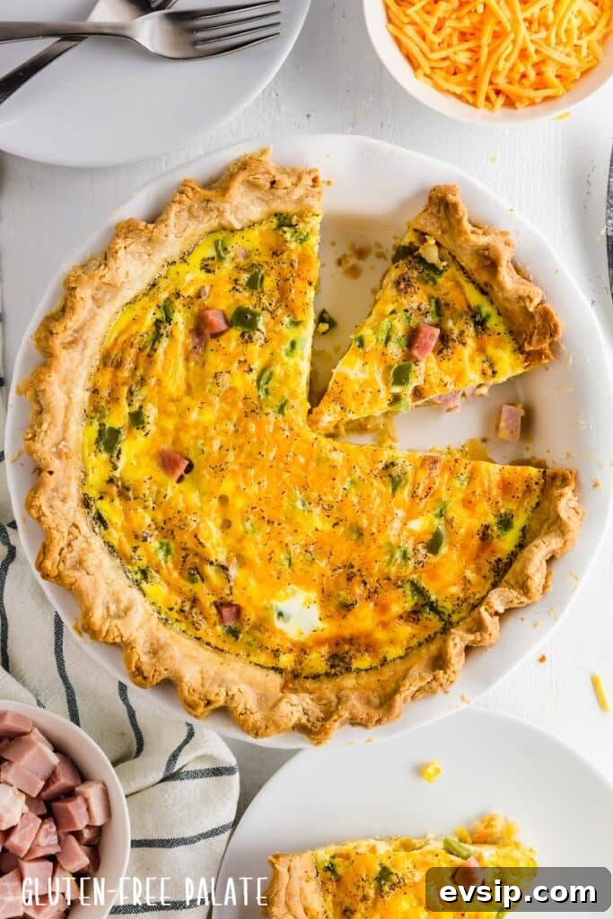 Irresistible Gluten-Free Brunch Recipes You’ll Crave Again 5 Gluten-free quiche in a white pie pan with a slice out.