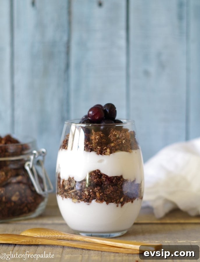 Irresistible Gluten-Free Brunch Recipes You’ll Crave Again 8 Paleo Granola layered with yogurt in a glass jar with a wooden spoon. Perfect for a light brunch.