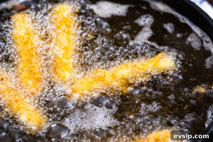 Frying cheese sticks.
