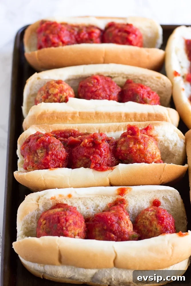 vegan meatball subs on a pan without cheese before being baked.