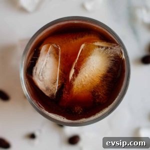 Cold Brew Coffee Concentrate: Ratios, Methods & Pro Tips 15 cold brew coffee in a glass full with ice seen from above