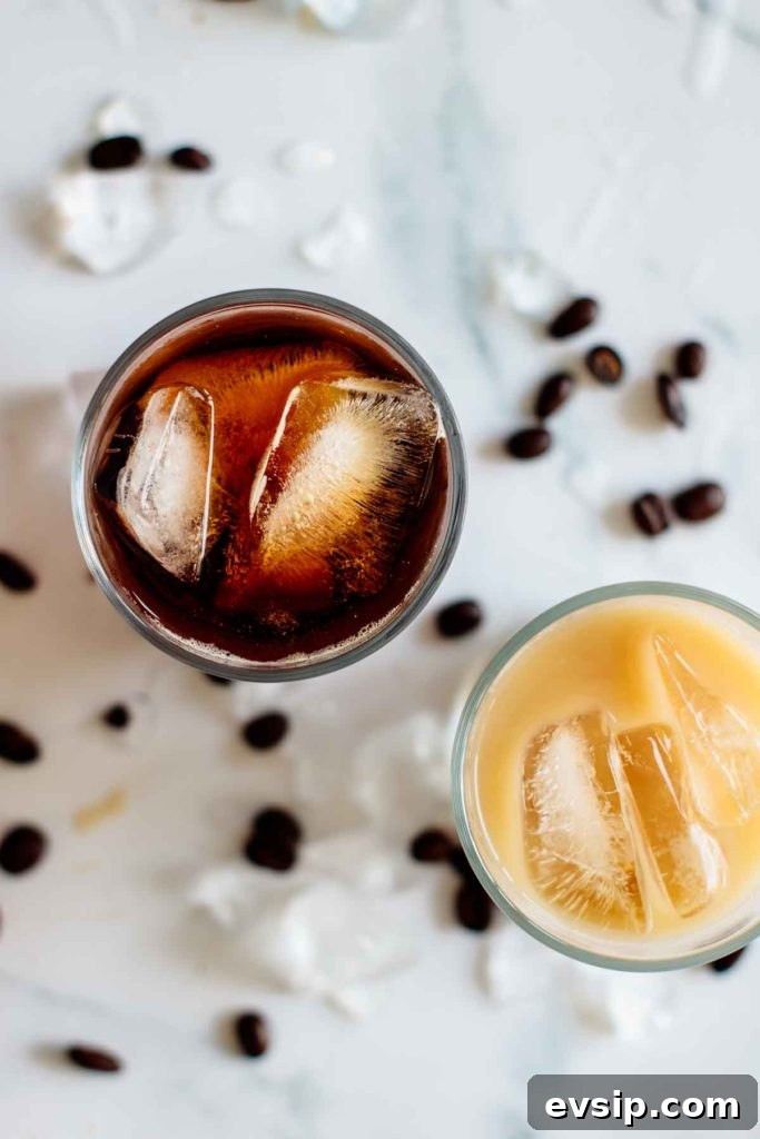 Cold Brew Coffee Concentrate: Ratios, Methods & Pro Tips 3 two cups of cold brew, one with it pure, one with it mixed with ice, seen from above