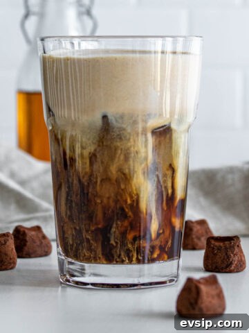 Chocolate Cream Cold Brew with chocolates around the glass.