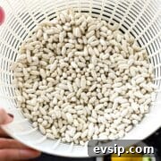 Great northern beans in a colander.