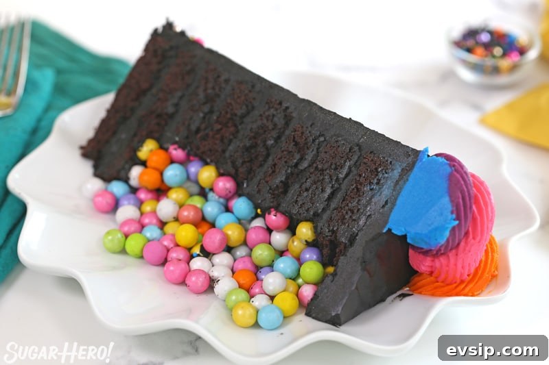 Piñata Cake Recipe with Video: Step-by-Step Guide 7 Slice of chocolate cake with colorful candy in front
