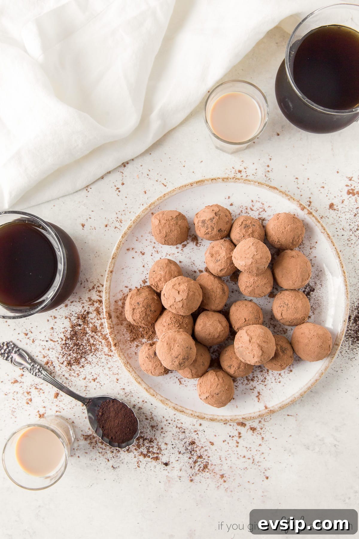 plate of chocolate espresso truffles; glasses of espresso and Irish cream next to plate