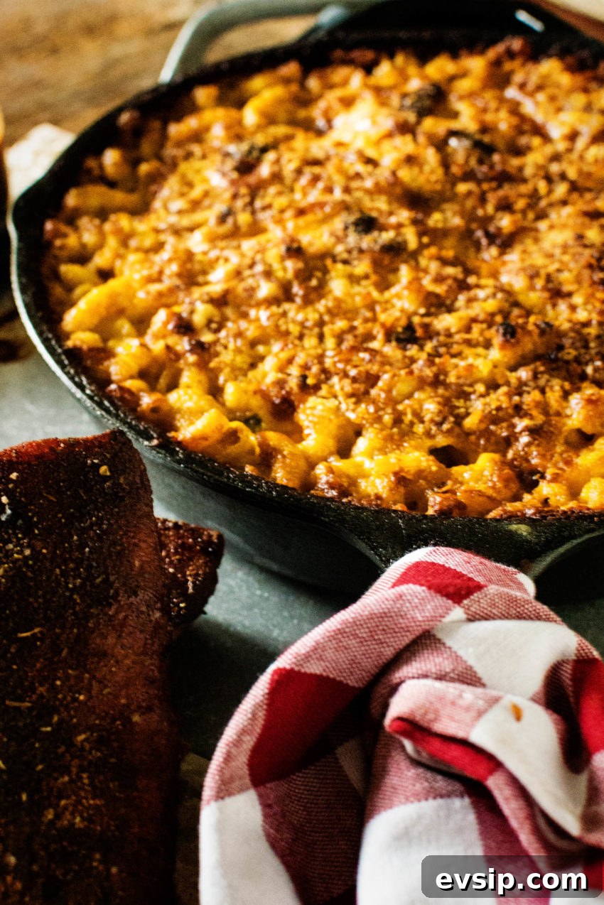 Smoky Jalapeño Mac and Cheese with Crispy Topping 3 Cast iron skillet loaded with smoke macaroni and cheese.
