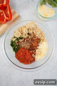 In a mixing bowl combine ground chorizo seasonings salsa garlic cooked rice poblano peppers and ½ cup cheese
