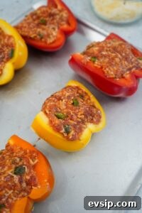 Pack the mixture into each pepper half