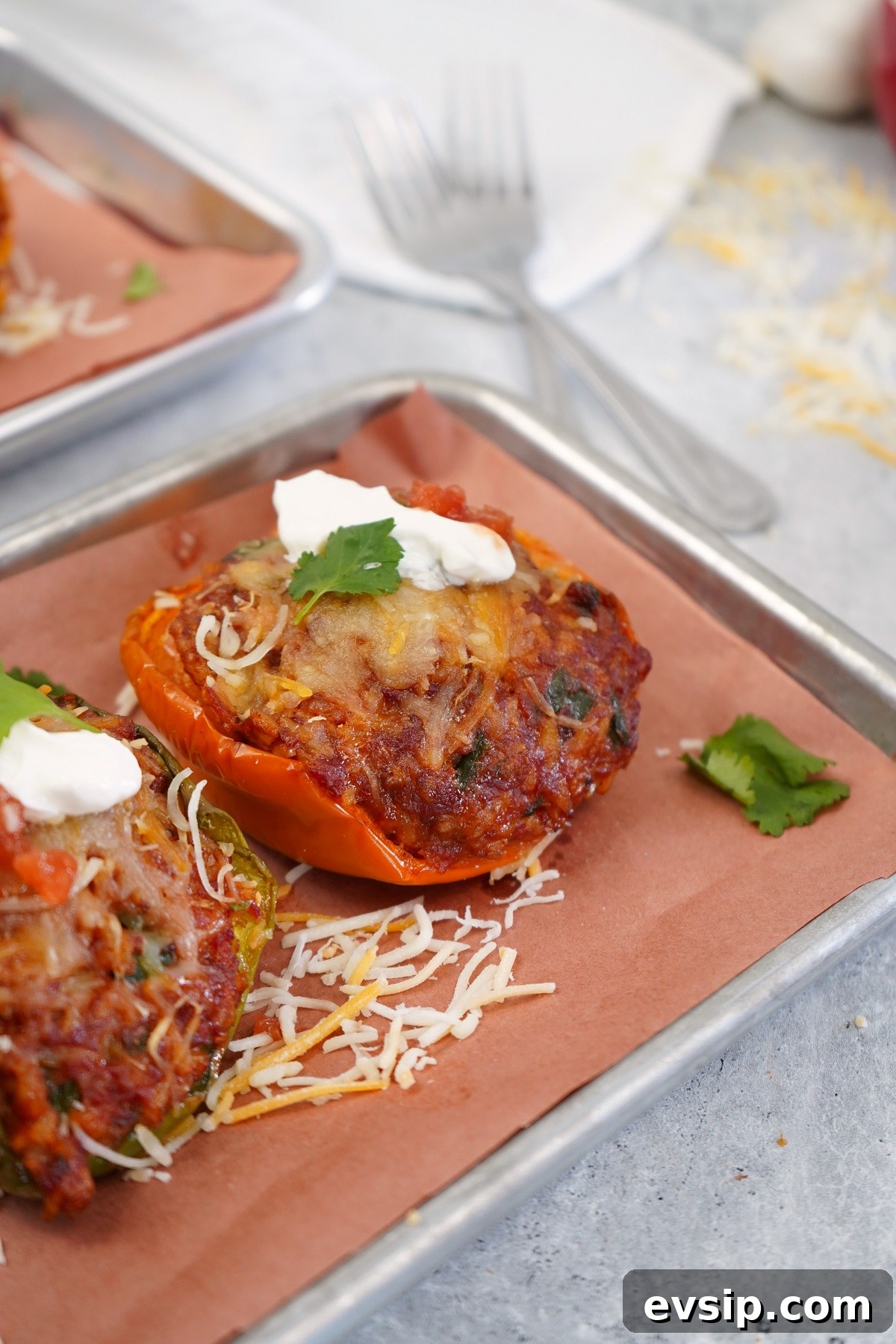 Smoked chorizo stuffed bell peppers on serving platter. 