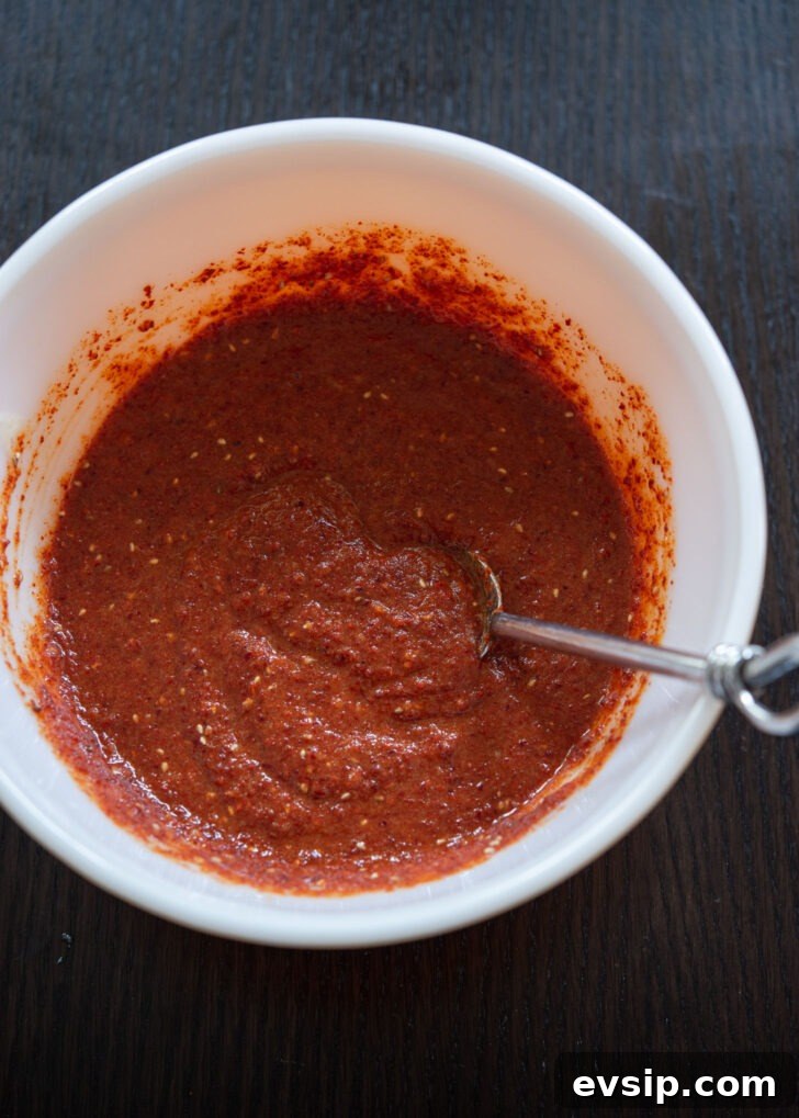 Bowl of spicy bibim naengmyeon sauce made with gochugaru, ready to mix with cold noodles