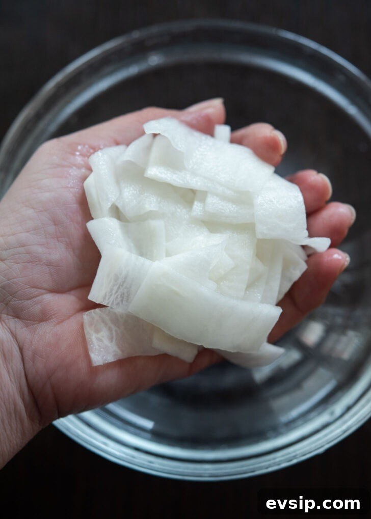 Quick-pickled Korean radish slices prepared for bibim naengmyeon topping