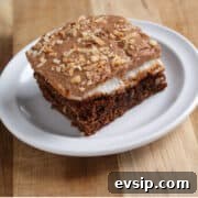 Mississippi Mud Brownies with Coconut Crumble 3 Mississippi mud brownie square on a white plate and wood board