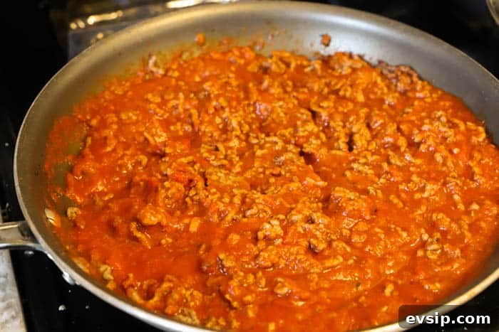 cooked ground beef and sauce