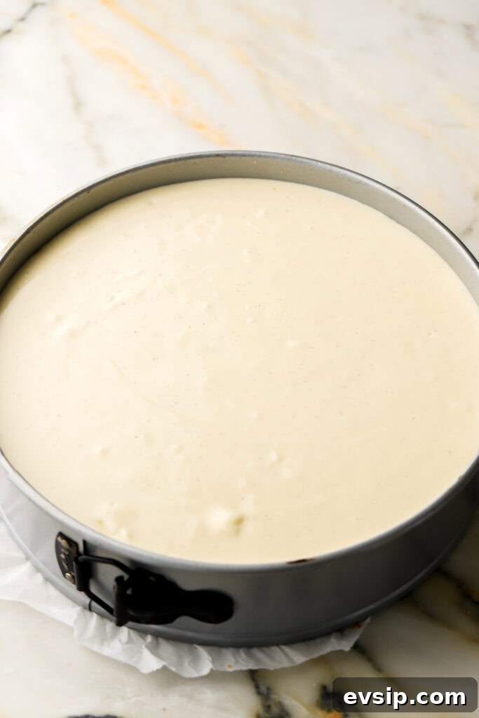 Banana Pudding Cheesecake Recipe with Creamy Layered Filling 13 rest of cheesecake batter poured in