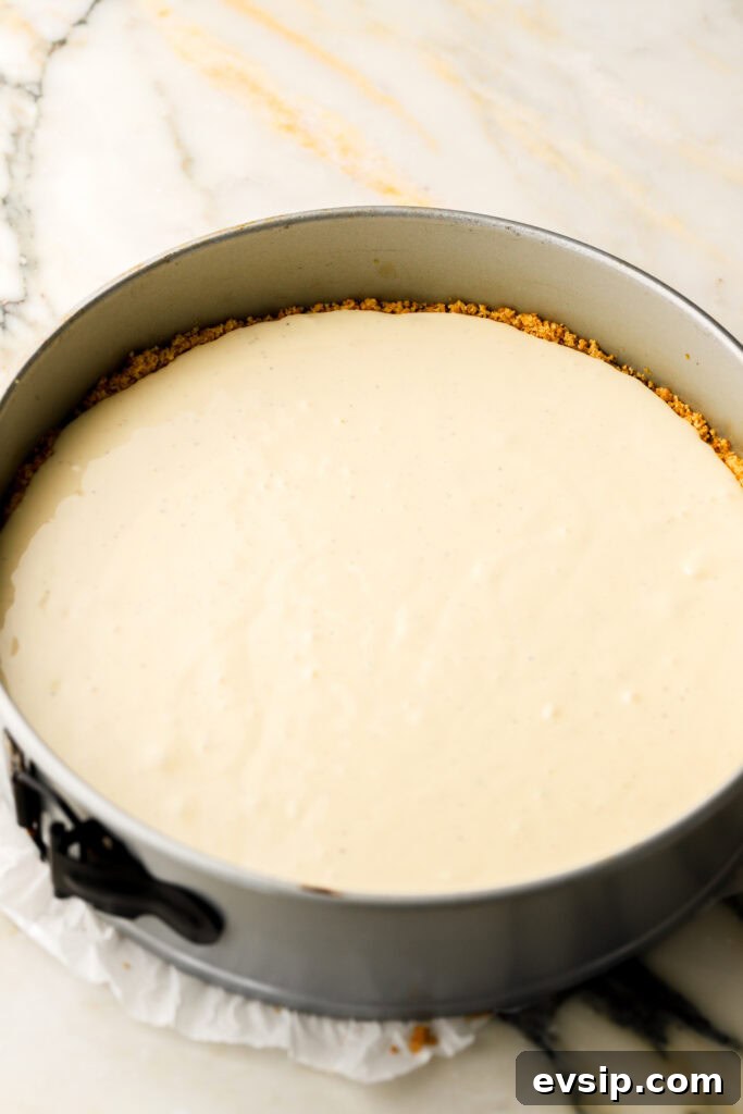 Banana Pudding Cheesecake Recipe with Creamy Layered Filling 10 half of cheesecake batter poured in