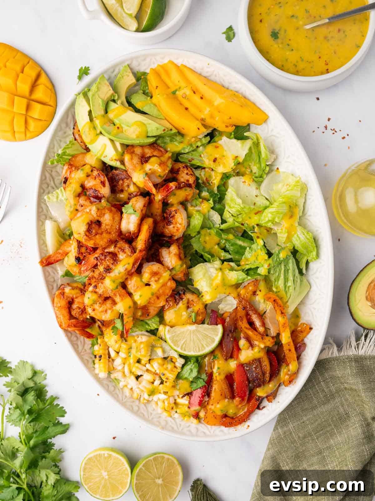 Shrimp salad with mango dressing on a platter.