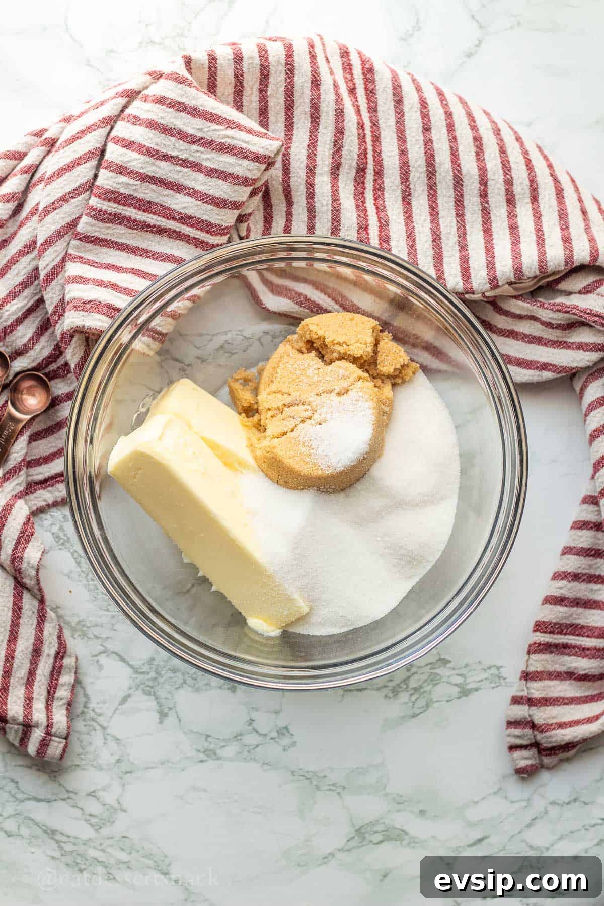 Butter and sugar in glass bowl.