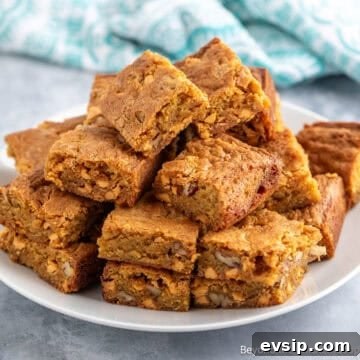 Butterscotch Brownies stacked on a white plate.