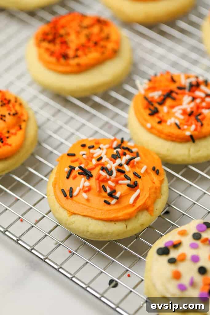 Lofthouse Cookie Recipe: Soft Frosted Sugar Cookies Guide 10 Halloween Lofthouse cookies on a baking rack.