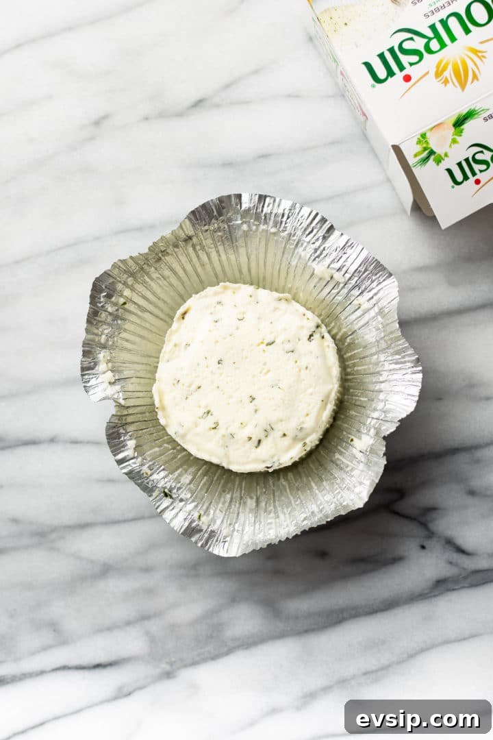 Creamy Boursin Pasta Recipe with Garlic and Herbs 3 Boursin cheese sitting in open foil wrapper with its packaging box to the side