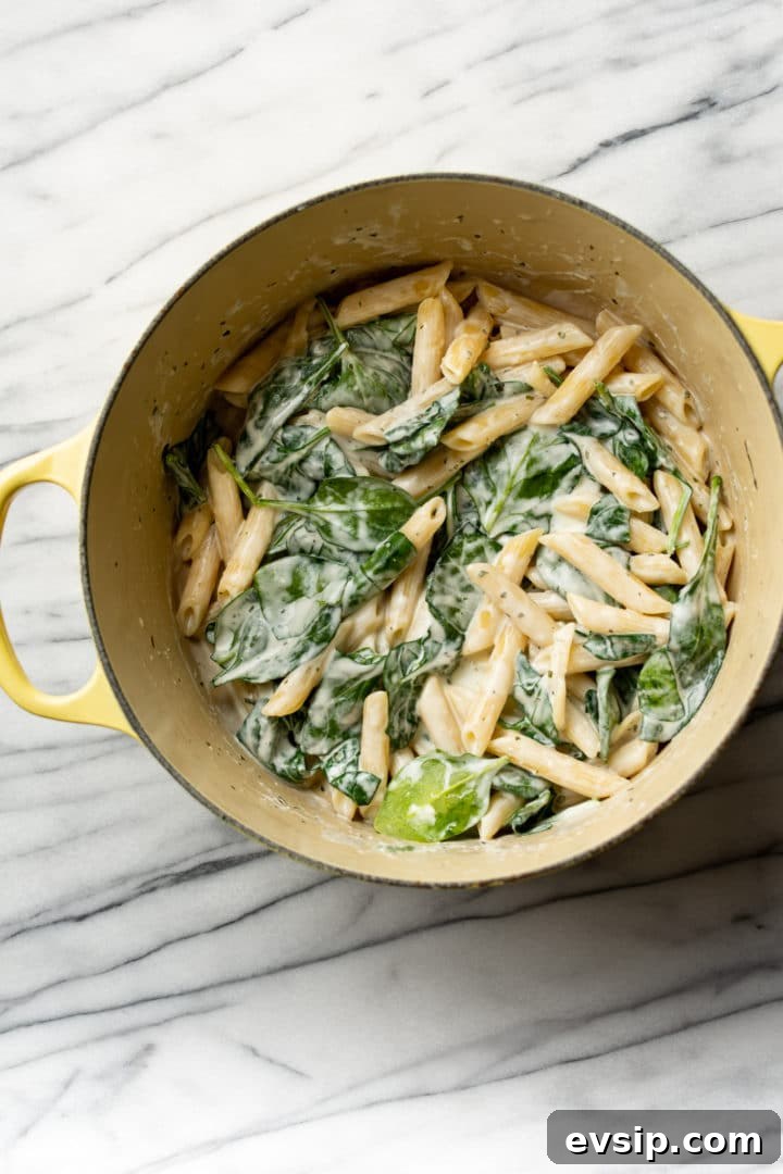 Creamy Boursin Pasta Recipe with Garlic and Herbs 4 Boursin pasta in a yellow pot
