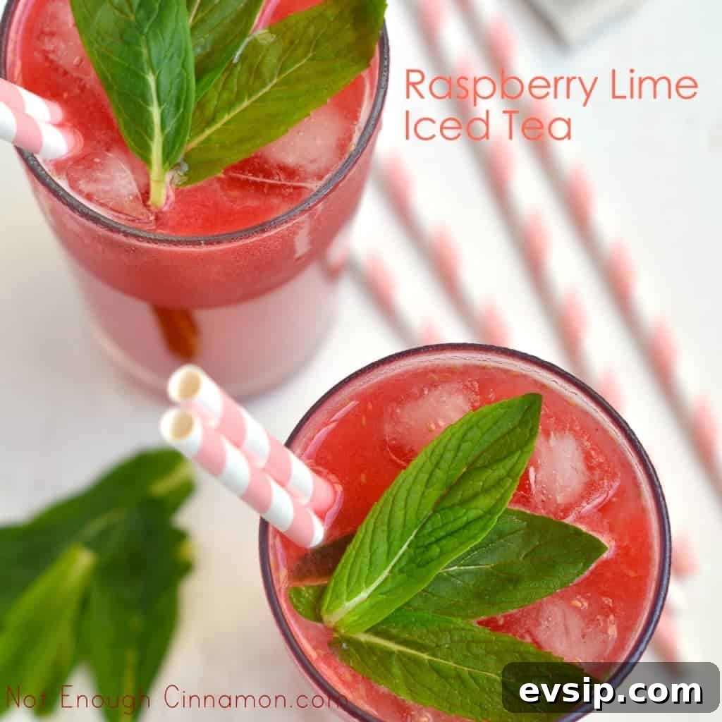 Refreshing Lime Raspberry Iced Tea Recipe You’ll Love 3 Lime Raspberry Iced Tea served in 2 tall glasses with straws and some fresh mint on top