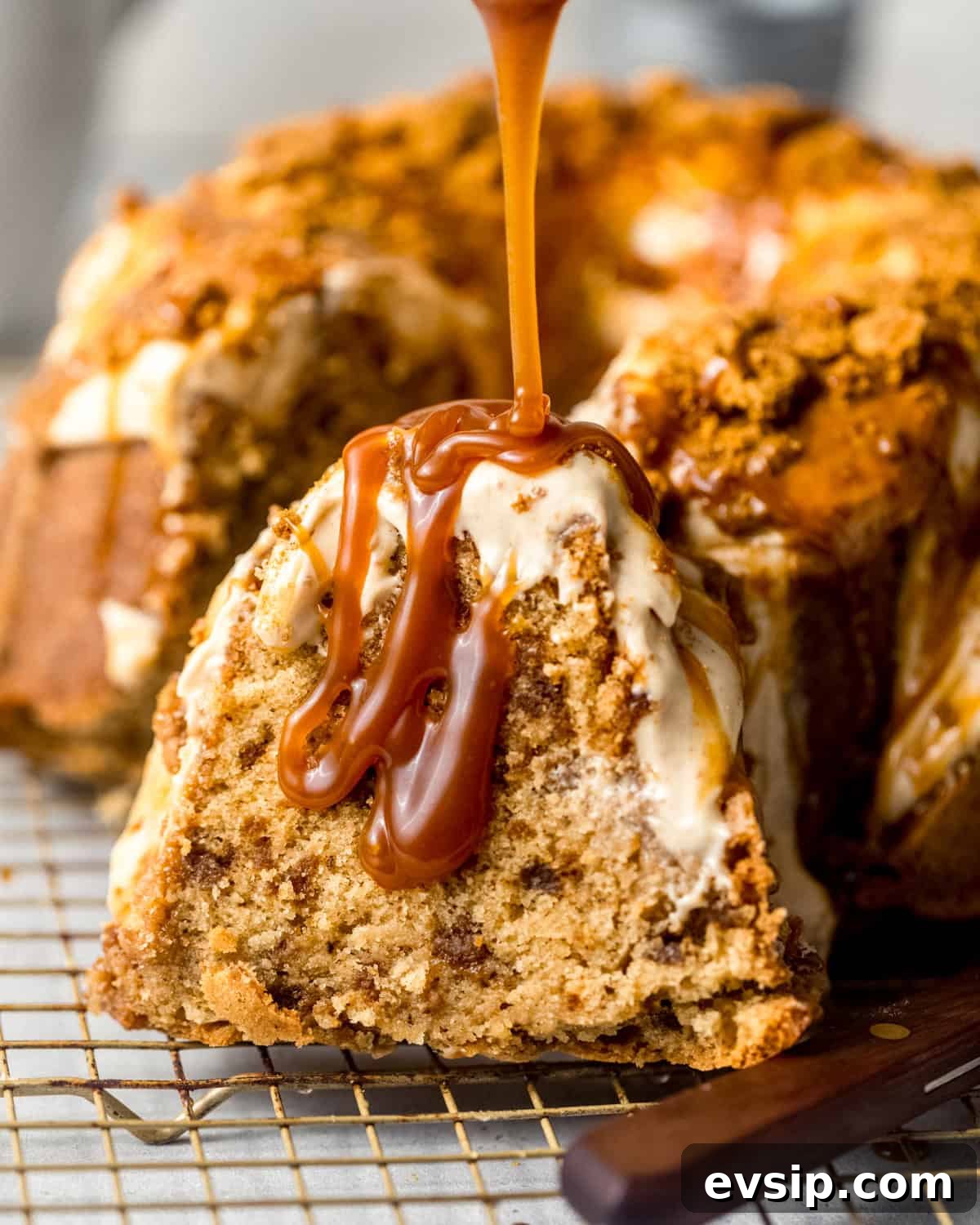 salted caramel being drizzled on top of a biscoff pound cake.