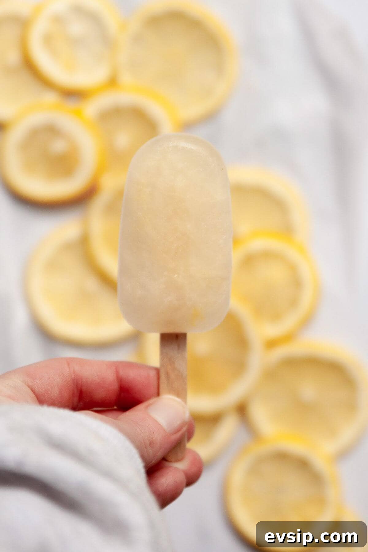 Homemade lemonade popsicles, naturally sweetened with honey and refined sugar-free.