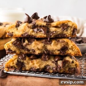 Three chocolate chip cookies cut in half and stacked, showing the melted chocolate chips inside.