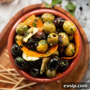 Flavorful Marinated Olives Recipe for Parties and Gifts 2 close up overhead shot of marinated olives in small brown pot