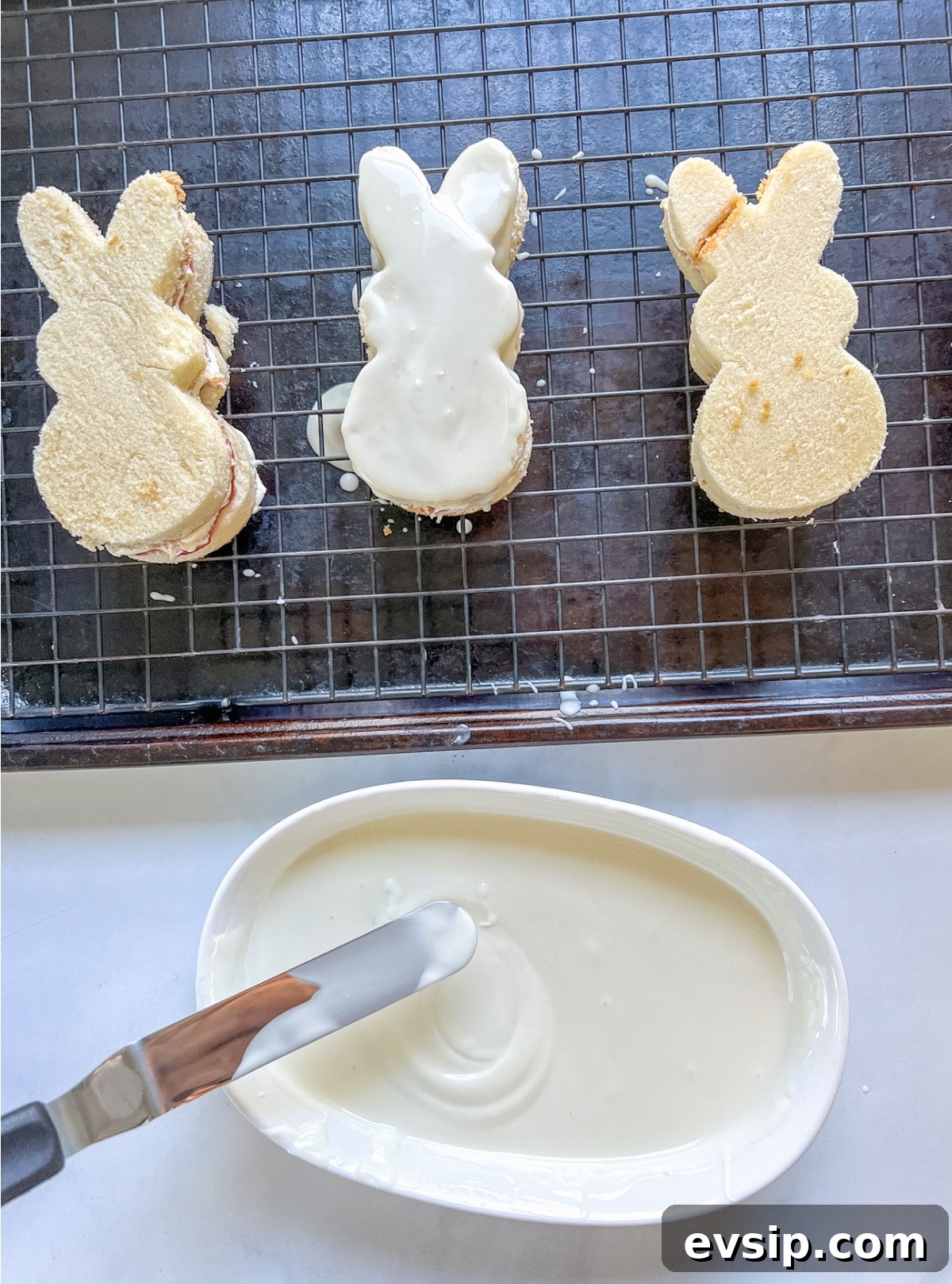 Dip bunny cakes in white melting chocolate